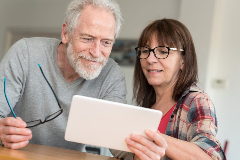 couple looking at bills together couple looking at bills together